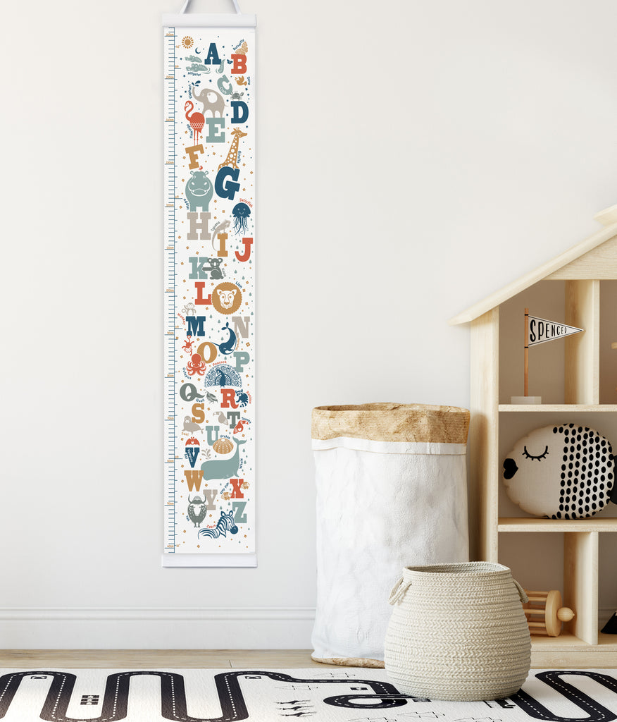Animal Alphabet Canvas Height Chart with white hangers in child's playroom